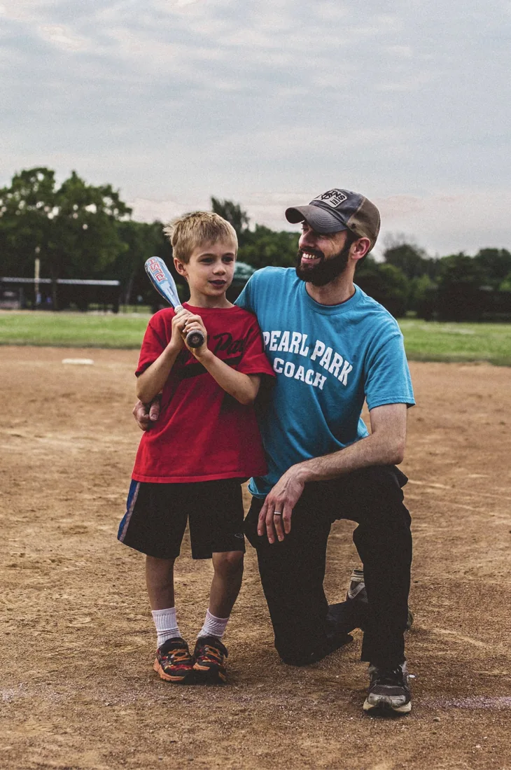 Eric with a young baseball player at the ballfield