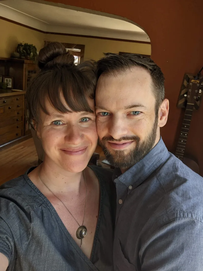 Eric and a woman smiling together